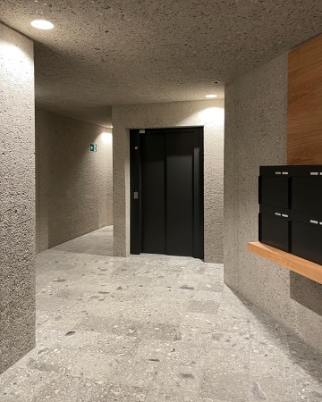 Türen, Eingänge aus Beton, Metall · Apartment Building Hofackerstrasse — EMI Architekten