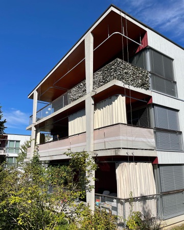 Fassaden, Balkone aus Beton, Holz · Wohnsiedlung Brüggliäcker — BS+EMI Architektenpartner