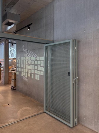 Türen aus Beton, Metall · Office and Commercial Building Binzstrasse — EM2N