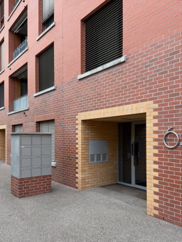 Fassaden, Eingänge aus Backstein · Wohnsiedlung Im Stückler — Adrian Streich Architekten