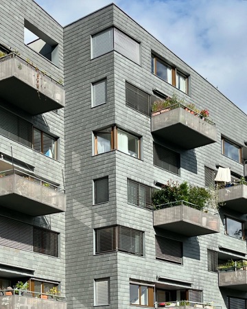 Fassaden, Fenster aus Metall, Naturstein · Wohnsiedlung Leimbachstrasse — pool Architekten